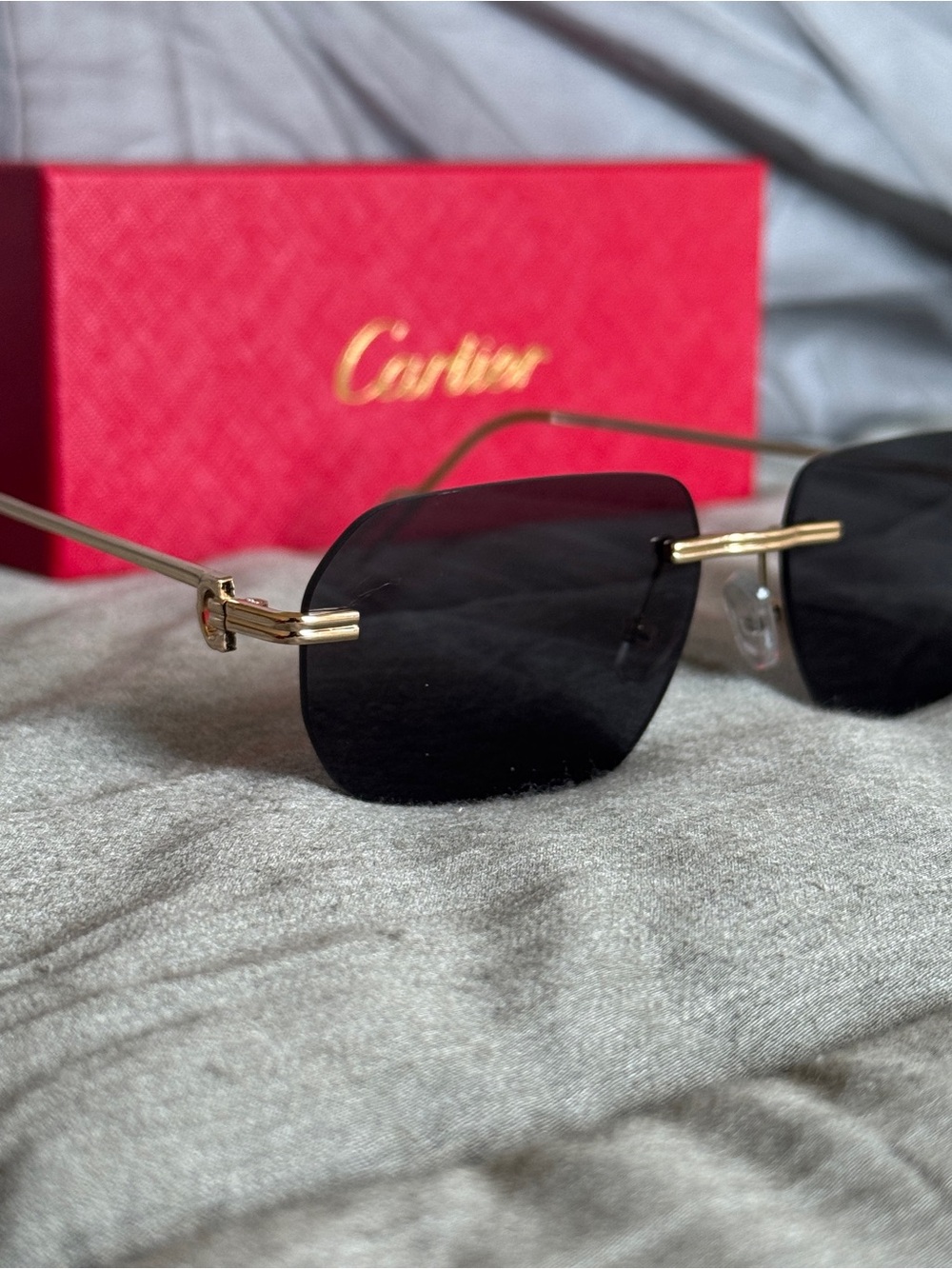 Cartier Gold Rimless Sunglasses with Black Lenses
